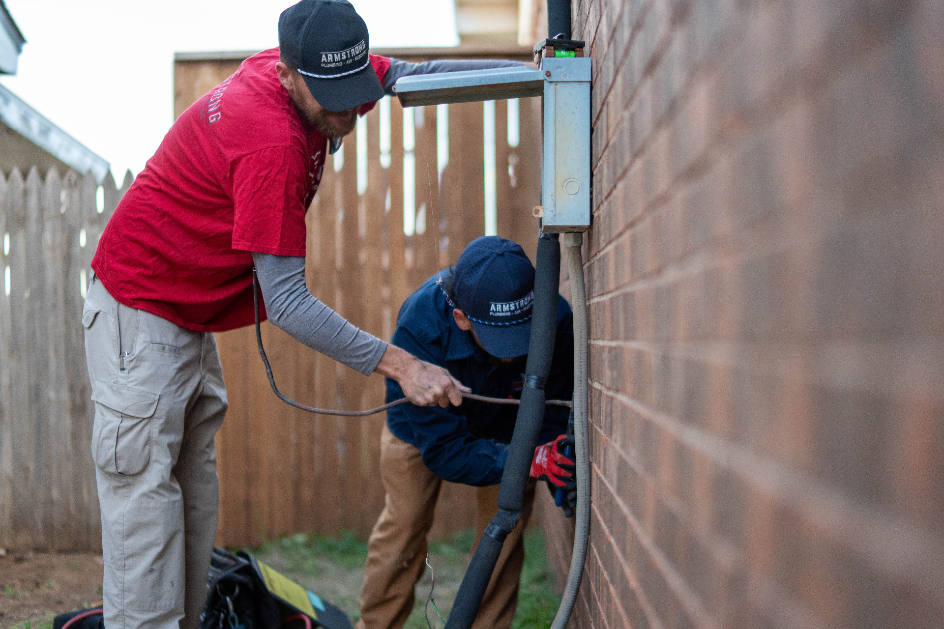 Armstrong technicians working together on HVAC system